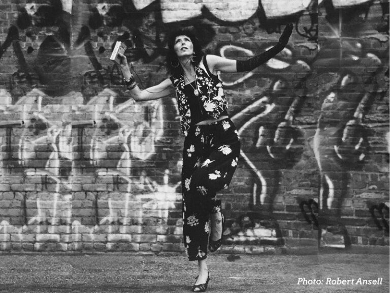 Gabrielle Roth dancing in front of street art (photo: Robert Ansell)